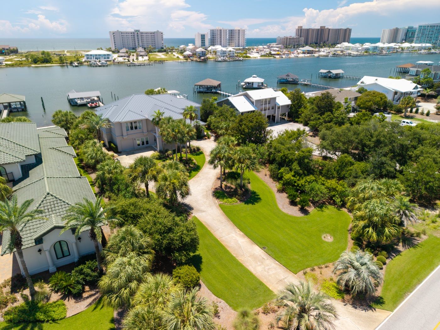Waterfront estate with private dock and canal, skyline in the background